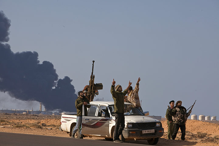 Week in Business: Rebel fighters in Ras Lanuf, Libya