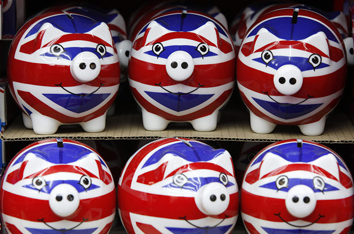 Week in Business: A row of piggy banks adorned with the Union Jack flag