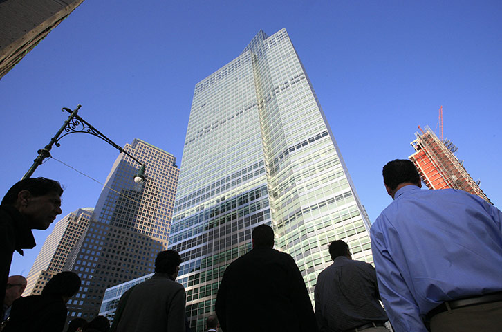 Week in Business: People walk to work outside the Goldman Sachs headquarters in New York
