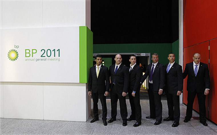 Week in Business: Security guards stand outside the BP annual general meeting in east London