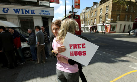 Free hugs at the launch of Action for Happiness