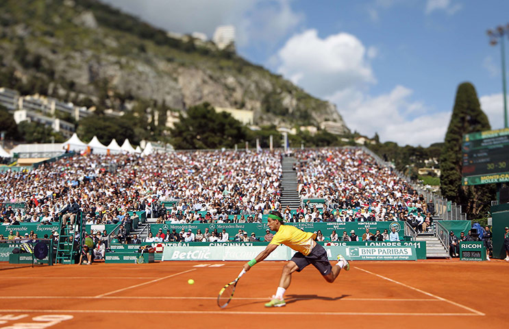 24 Hours in Pictures: Spain's Rafael Nadal hits a return to his opponent Ivan Ljubicic of Croatia