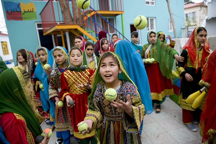 24 hours: Kabul, Afghanistan: A girl juggles tennis balls