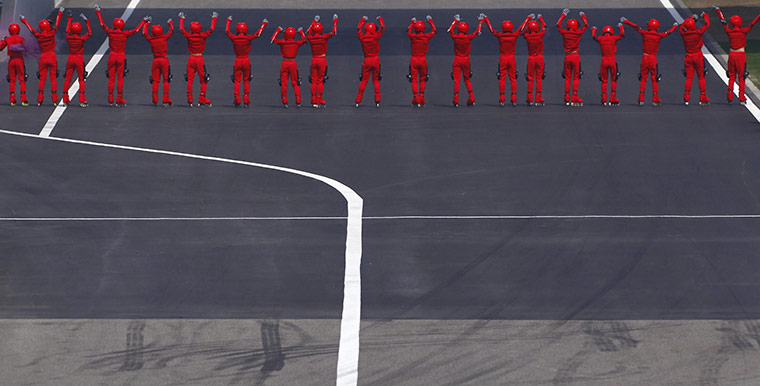 24 hours: Shanghai, China: Dancers perform before the Chinese F1 Grand Prix