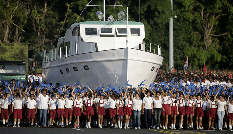 Bay of Pigs anniversary: Cuban children march next to a replica of the Granma