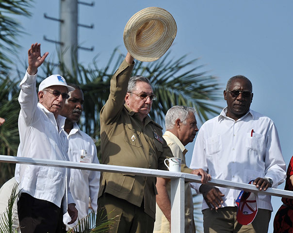 Bay of Pigs anniversary: Cuban President Raul Castro, centre, waves