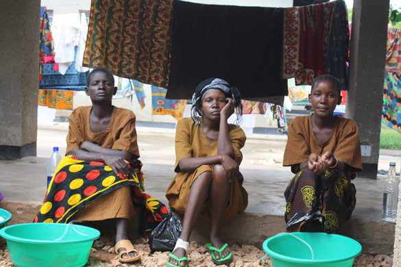 Women sit outside the CCBRT fistula ward, Tanzania
