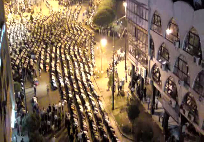 Syria protests: Syrian anti-regime protesters performing evening prayers 