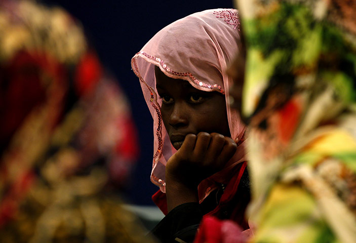  Misrata, Libya : A Ghanaian migrant worker waits to disembark in the port of Benghazi
