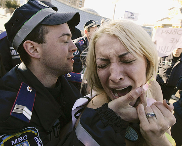 24 hours in pictures: an activist from the women's rights organisation Femen during a protest 