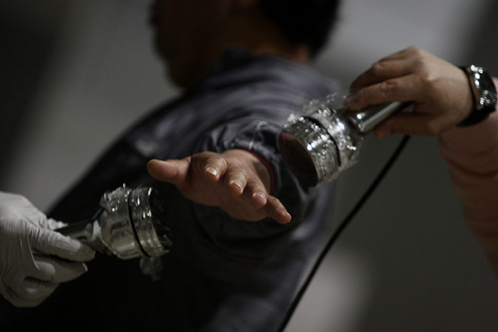 24 Hours in pictures: A man is screened for radiation in Japan