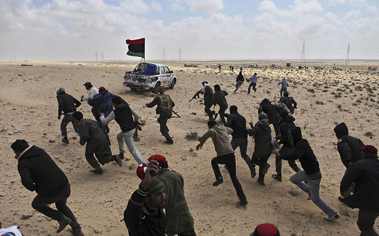 24 Hours in pictures: Libyan rebels run for cover after coming under heavy artillery fire