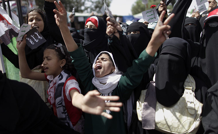 24 Hours in pictures: Female anti-government protestors shout slogans during a protest in Sana'a