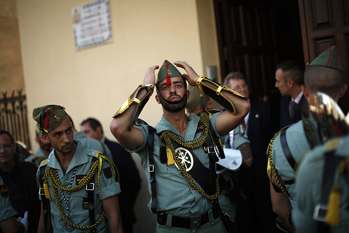 Holy Week in Malaga: Spanish legionnaires prepare for a change of honour guard