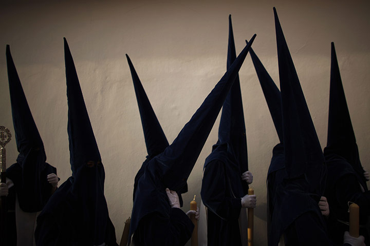 Holy Week in Malaga: Penitents take part in the procession of 