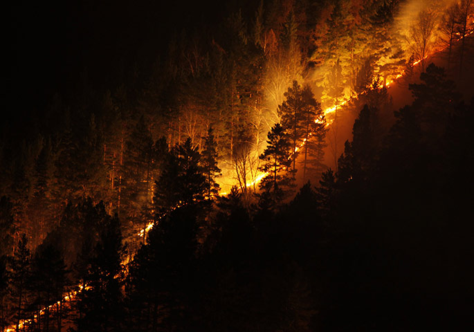 24 hours in pictures: A wildfire burns in the Taiga