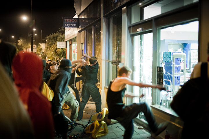 Tesco riots in Bristol: People smash the windows of the newly opened Tesco Express supermarket 