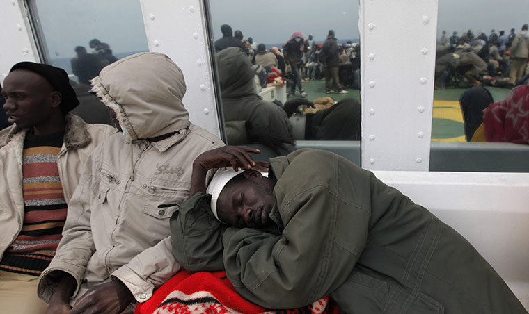 Misrata Libya: A foreign evacuee sleeps on deck of the Ionian Spirit ferry