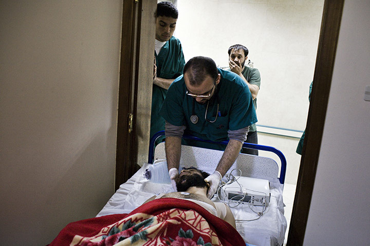 Guy Martin Libya: A doctor tends to a Libyan rebel who was shot in the spine