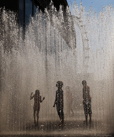 24 Hours: Children play in the water fountain outside the Royal Festival Hall