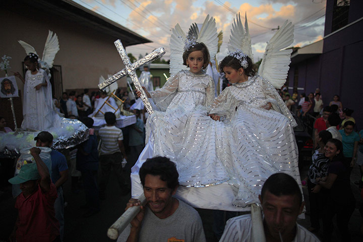 24 Hours: Girls dressed as angels during a Holy Week procession in Nicaragua