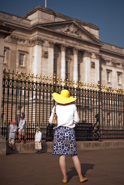 warm bank holiday weather:  A tourist looks at Buckingham Palace in London 