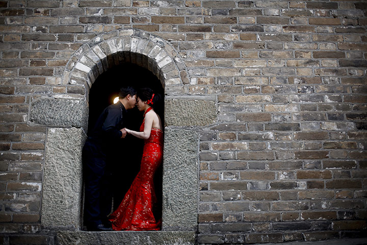 24 hours in pictures: A couple have their wedding photos taken on the Great Wall of China