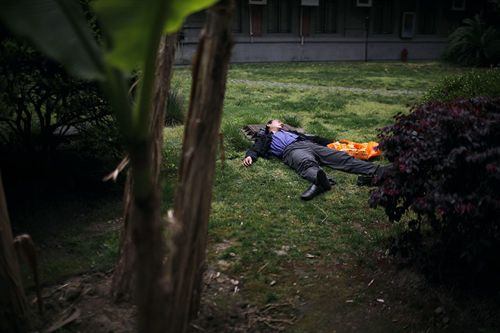 24 hours in pictures: A man sleeps in the garden of the Art Museum of Shanghai