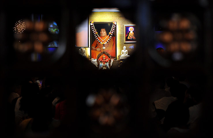 Sai Baba funeral: Followers of the Indian spiritual leader Sai Baba attend a special ceremony