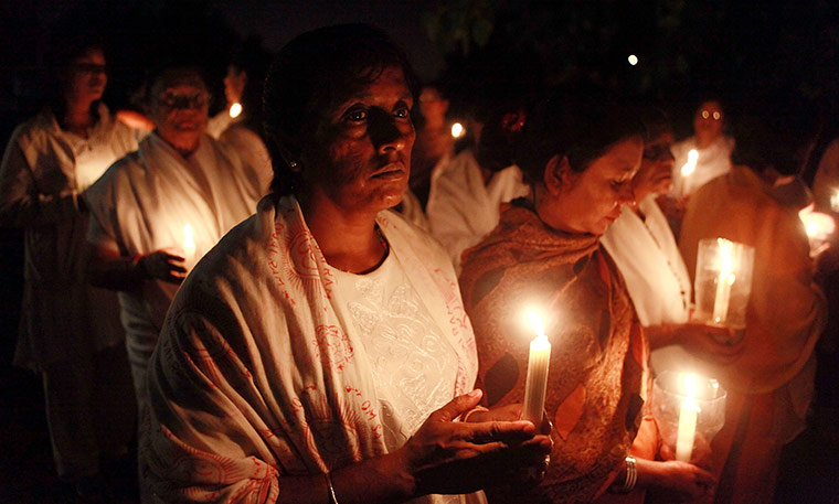Sai Baba funeral: Devotees hold a candle light vigil as at the Parasathi Temple in Durban