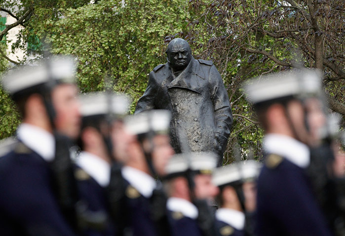 Royal Wedding rehearsal: Sailors of the Royal Navy march past the statue of Winston Churchill