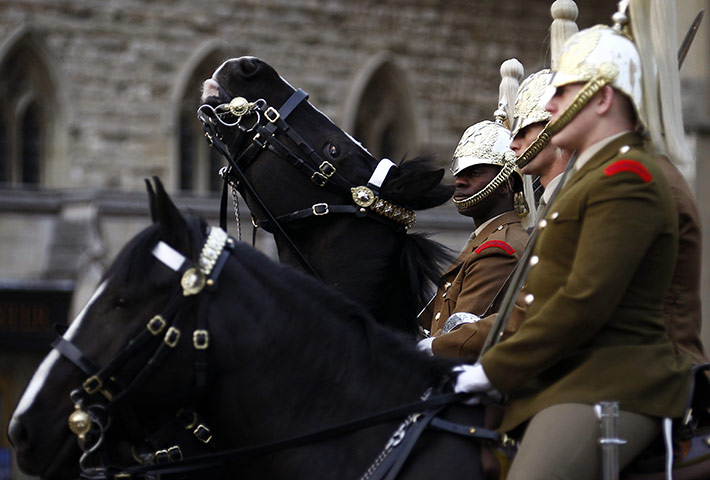 Royal Wedding rehearsal: Soldiers sit on their horses outside Westminster Abbey in London