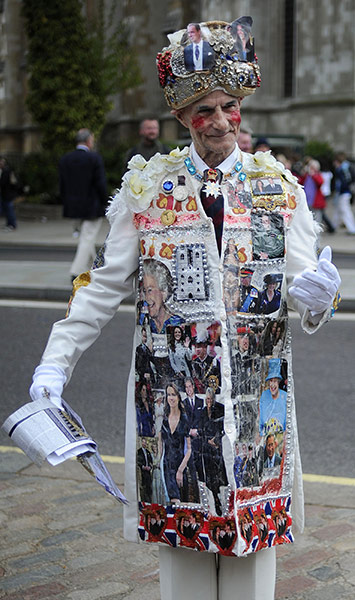 Royal Wedding rehearsal: A man wears a coat decorated with pictures of William and Kate