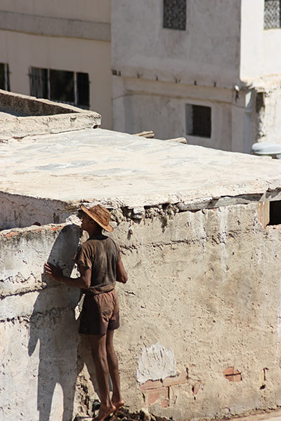 In pictures: voyeurism: man sneaking a peak at the tannery in Fez