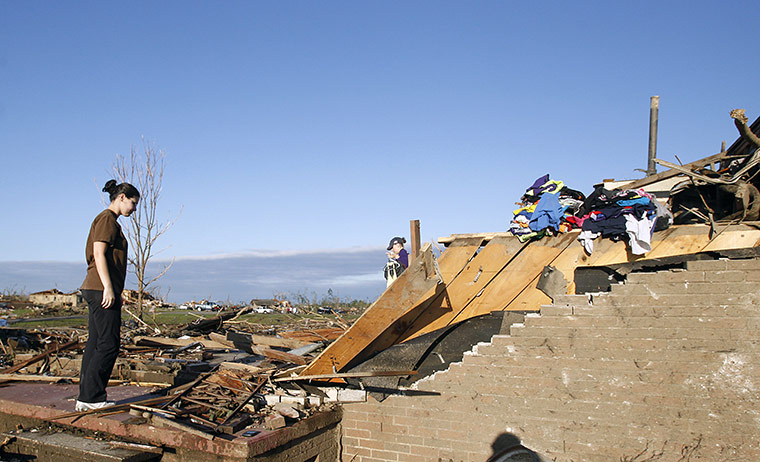 US Tornado: Tiffany Wood stands on the doorstep of what is left of her home