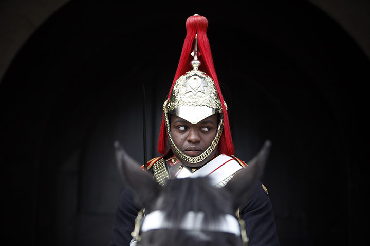 Preparations for wedding: A Guardsman sits on his horse on Whitehall