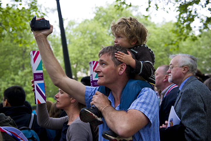 Wedding procession: People watch the wedding in St James' Park