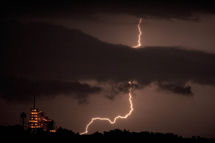 24 hours in pictures: Lightning strikes the near the space shuttle Endeavour