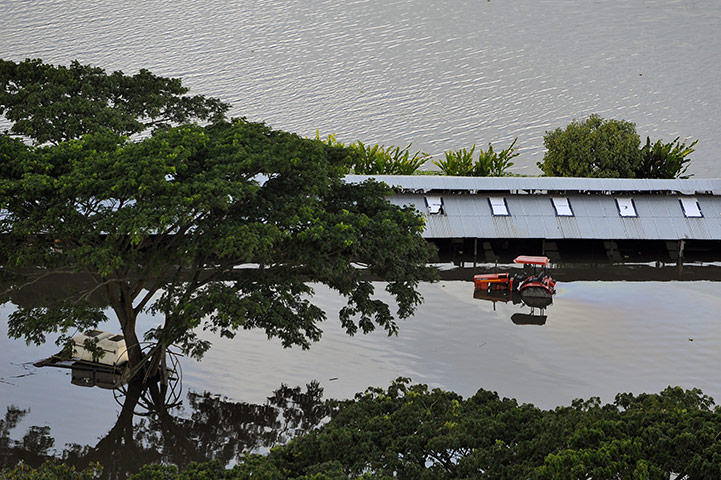 24 hours in pictures: Aerial view of a flooded farm on the banks of the Cauca river, Colombia