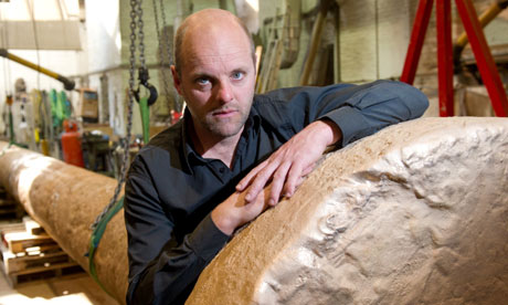 Gavin Turk with his sculpture Nail.