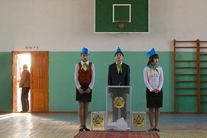 24 hours in pictures: Akai, Kazakhstan: School pupils stand by ballot boxes