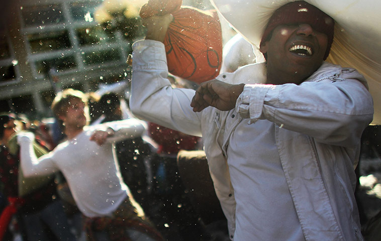 24 hours in pictures: New York City, New York, USA: Fighters battle during a massive pillow fight