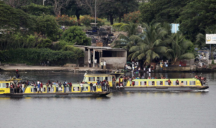 Ivory Coast Abidjan: 3 April: Youth supporters of President Laurent Gbagbo take boats to palace