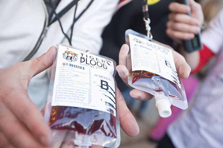 Charlie Sheen's show: Charlie Sheen fans pose for pictures with Tiger Blood energy potion