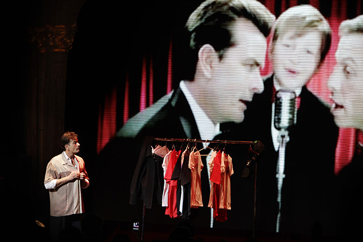 Charlie Sheen's show: Charlie Sheen looks towards a projection image from Two and a Half Men 