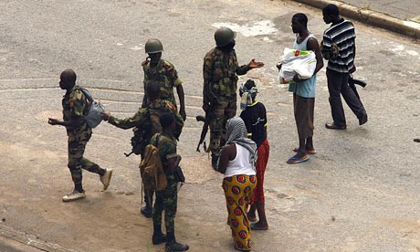 Forces loyal to Laurent Gbagbo question civilians in Abidjan