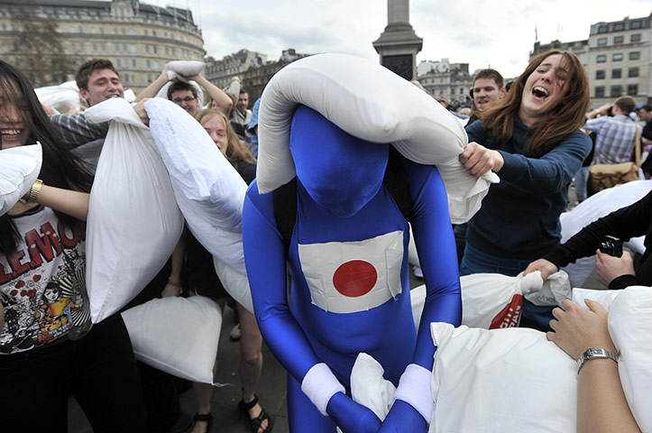 Pillow fight day: London, England: People pillow fighting in Trafalgar Square