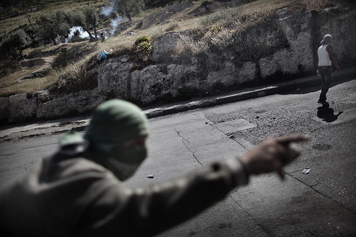24 Hours: Palestinian youths demonstrate during clashes with Israeli police forces
