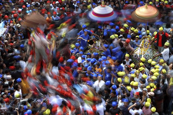 24 hours in pictures: Kathmandu, nepal: Devotees participate in the Chariot Festival