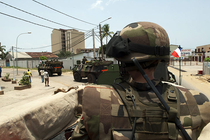 ivory coast: French armoured vehicles a patrol in Abidjan 
